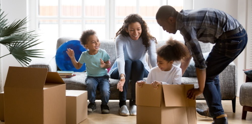 This image: an illustrative photo of a family playing and unpacking boxes in a new home.
						 The map: the map now shows a block plan of where the proposed housing could be located in the site,
						 with existing and proposed trees shown in green, private gardens and public open space, and the proposed
						 cul-de-sac road layout and footpaths crossing the site.